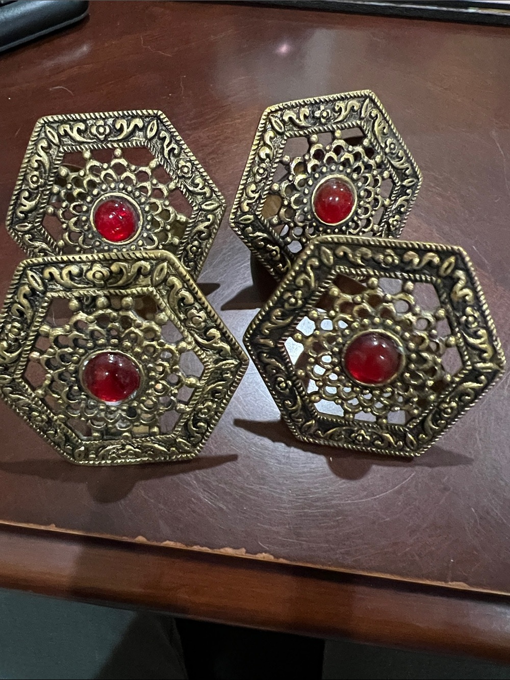 Brass napkin rings with red cabochon in center, set of 4, vintage